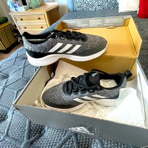 Brand new Adidas shoes with tags and box.  Never worn.  They were ordered twice